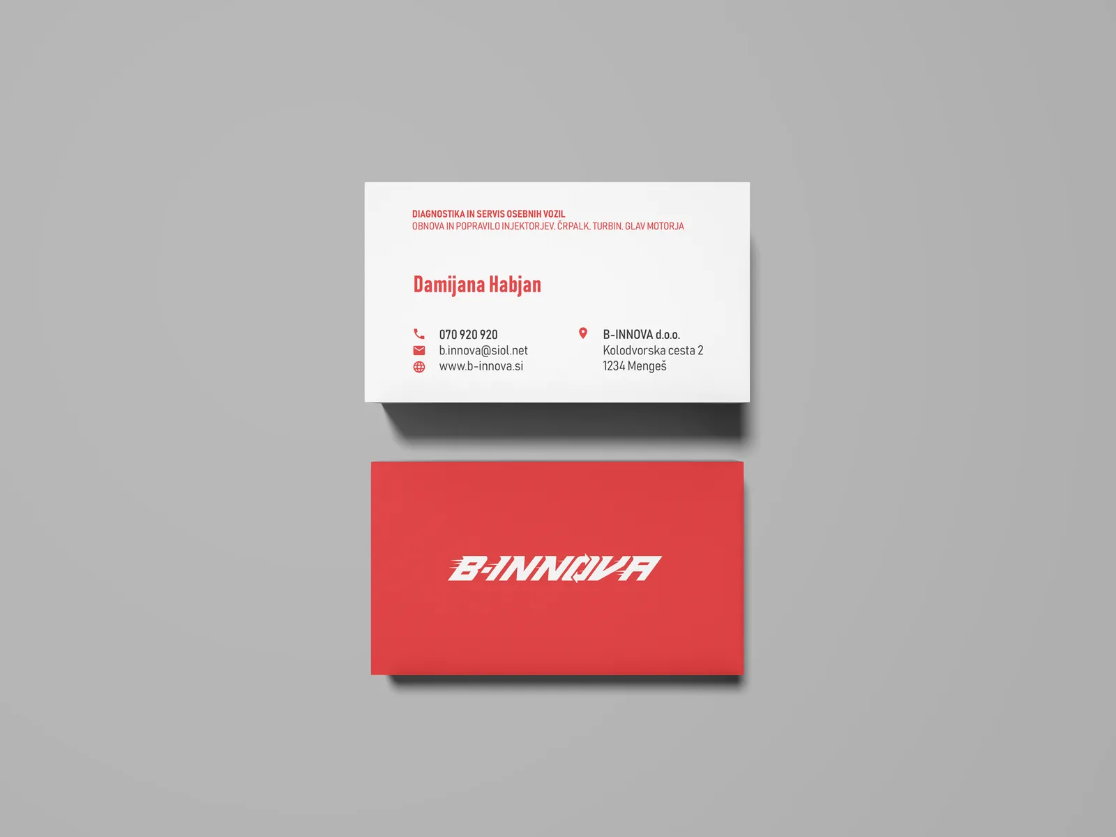 B-Innova business card mockup, white info side and red side with bold white logo