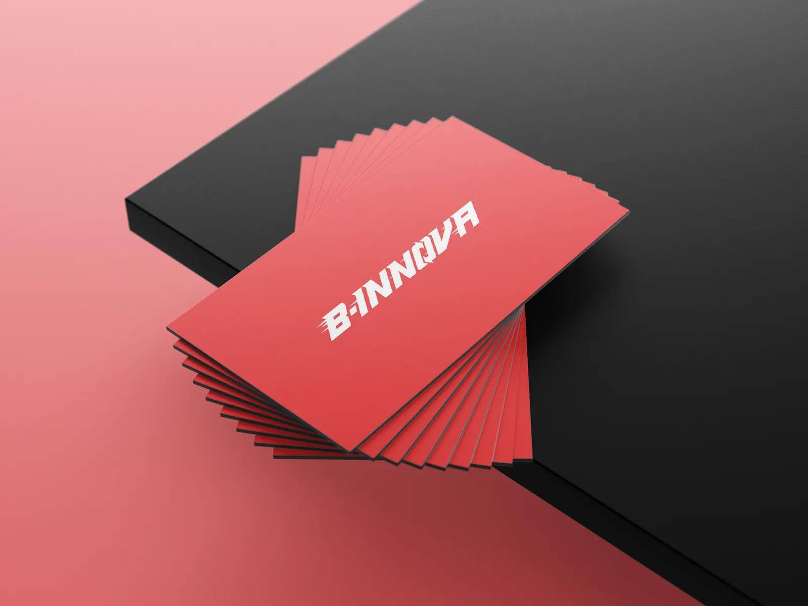 B-Innova red business cards fanned in a stack, dynamic angled mockup
