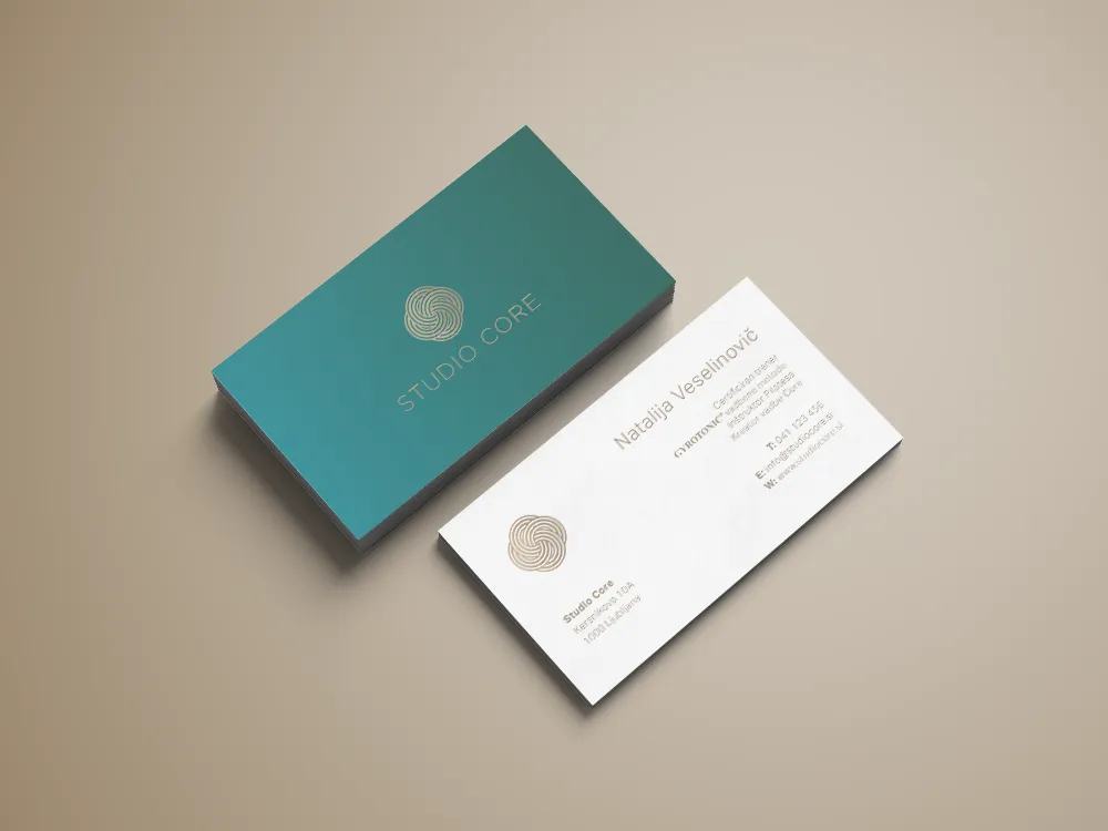 Studio Core business cards mockup, teal and white cards with gold knot logo