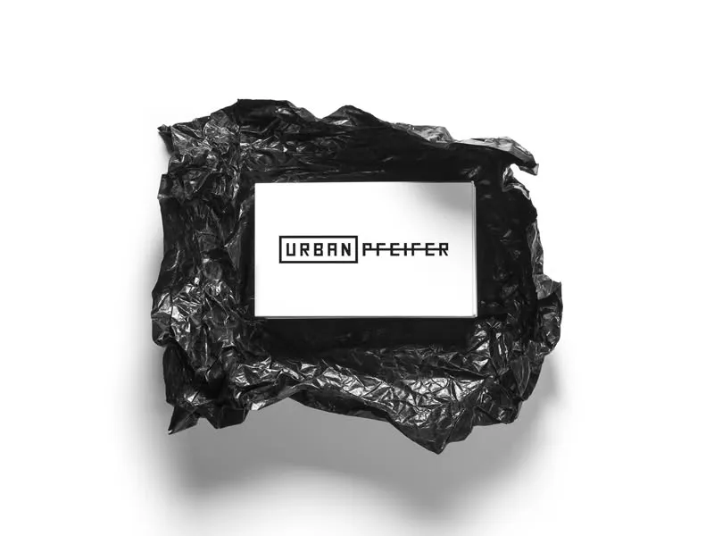 Urban Pfeifer business cards nested in crumpled black wrap
